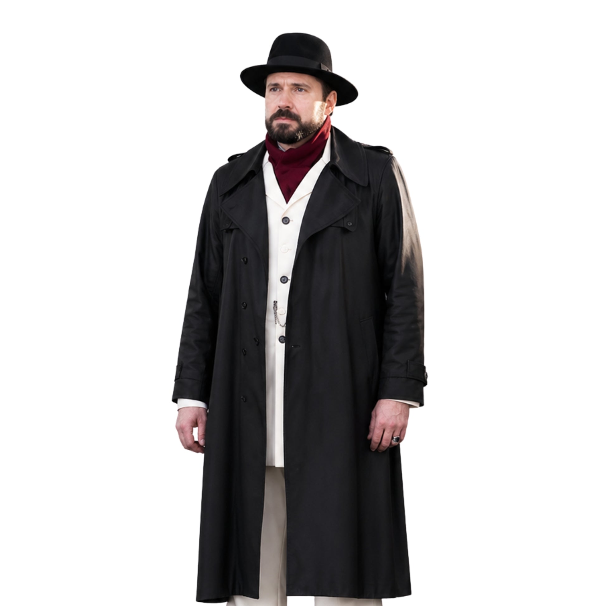 Man wearing a long black coat, hat, and red sweater on a white background