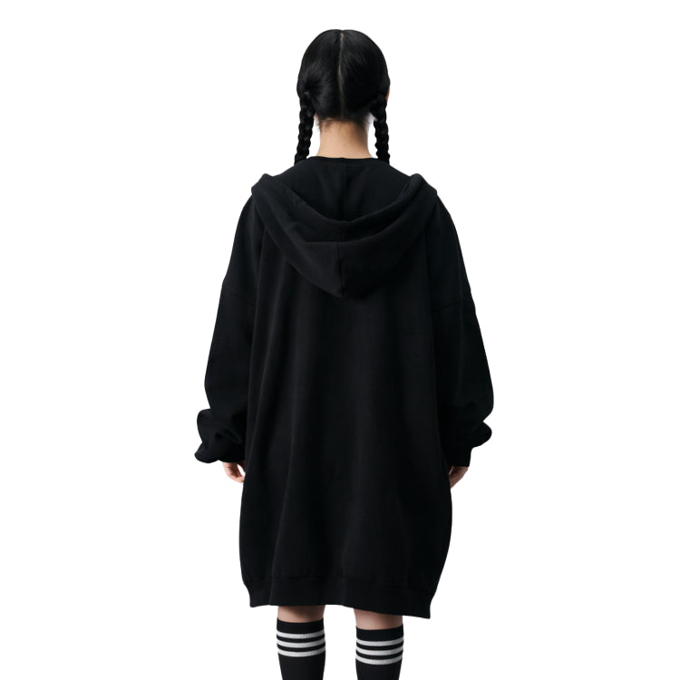 Person wearing a black hoodie from behind on a white background