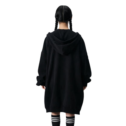 Person wearing a black hoodie from behind on a white background