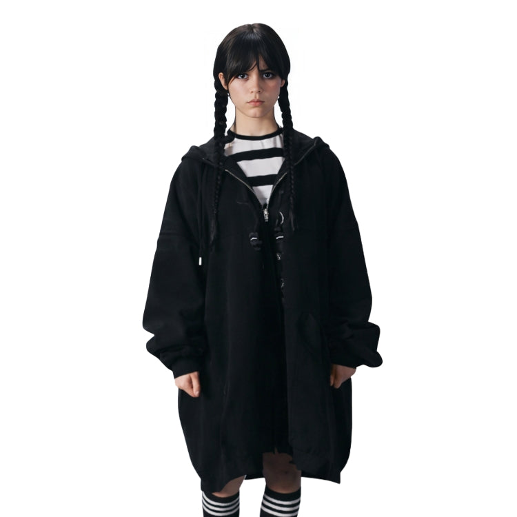 Person wearing a black hooded coat on a white background