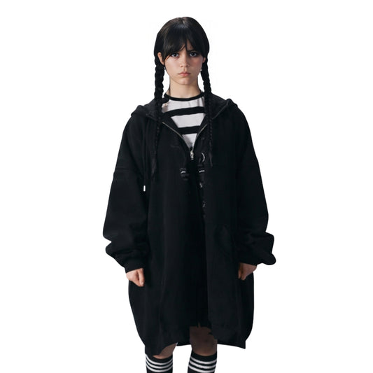 Person wearing a black hooded coat on a white background