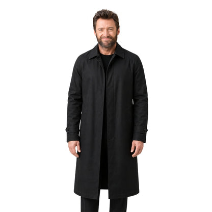 Man wearing a black coat on a white background