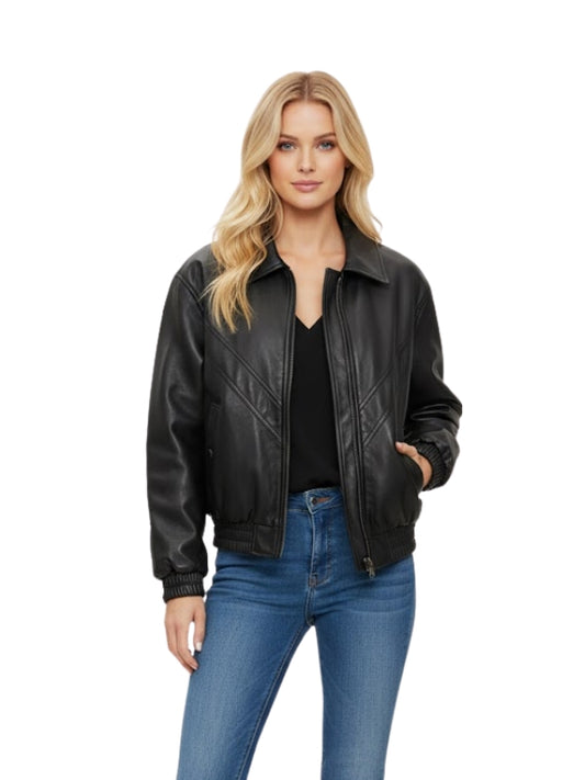 Woman wearing a black leather jacket and blue jeans on a white background