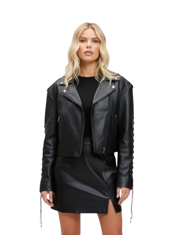 Woman wearing a black leather jacket and skirt on a white background
