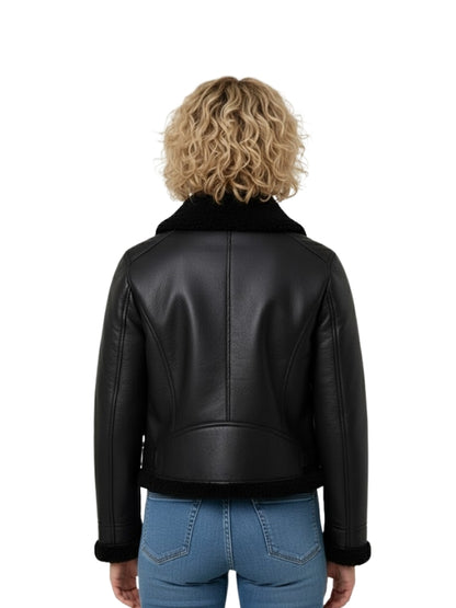 Person wearing a black leather jacket with a white background