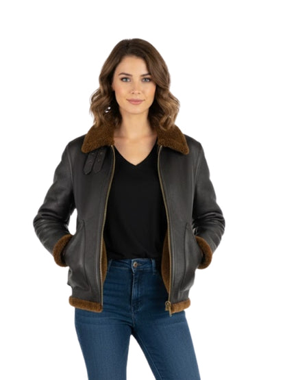 Woman wearing a black leather jacket with brown fur trim on a white background