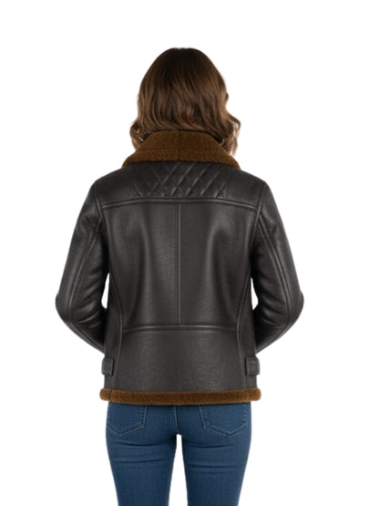 Person wearing a black leather jacket with brown shearling lining on a white background