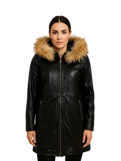 Woman wearing a black leather coat with fur hood on a white background