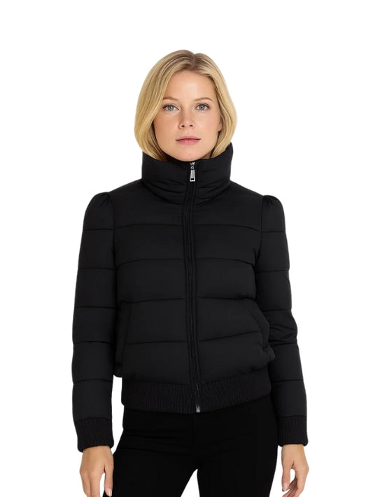 Woman wearing a black puffer jacket on a white background