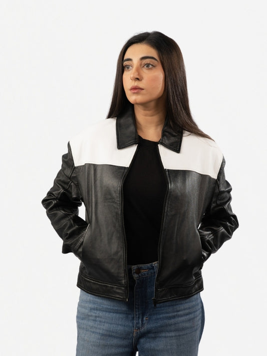 Woman wearing a black and white leather jacket on a white background