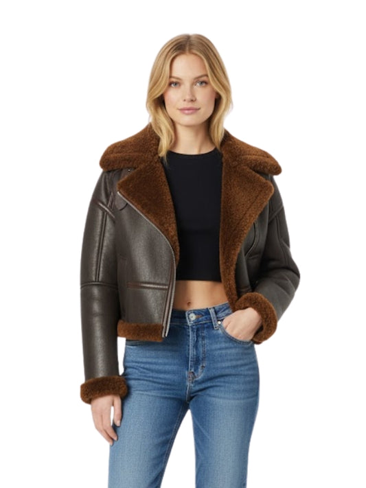 Woman wearing a brown leather jacket with fur trim on a white background