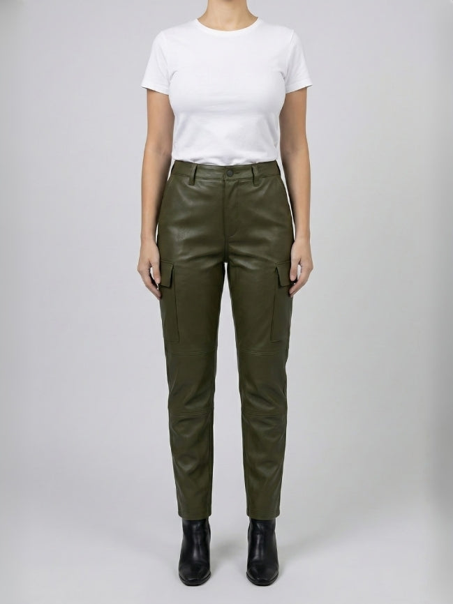 Person wearing olive green pants and a white shirt on a plain background