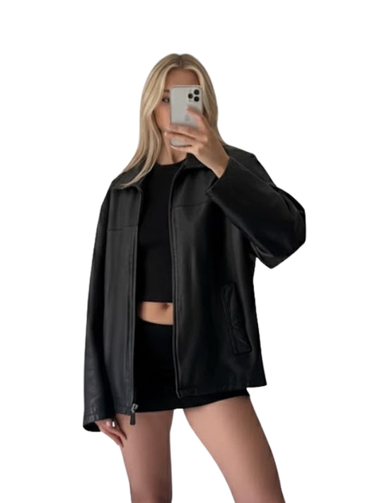 Person wearing a black leather jacket and black outfit on a white background