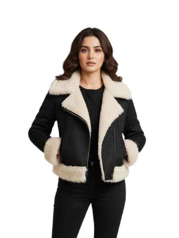 Woman wearing a black and beige shearling jacket on a white background