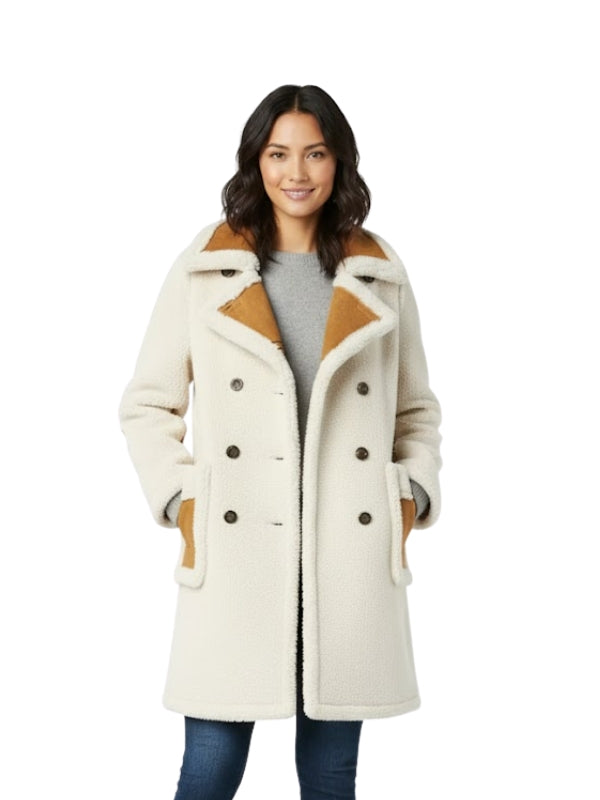 Woman wearing a cream-colored coat with brown accents on a white background