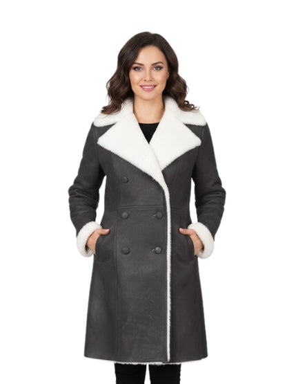 Woman wearing a gray coat with white fur trim on a white background