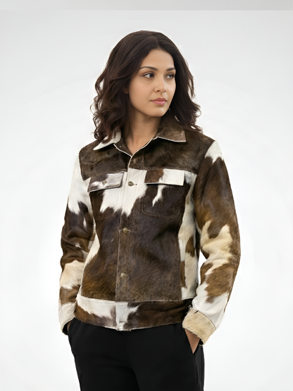 Woman wearing a brown and white cowhide jacket on a white background