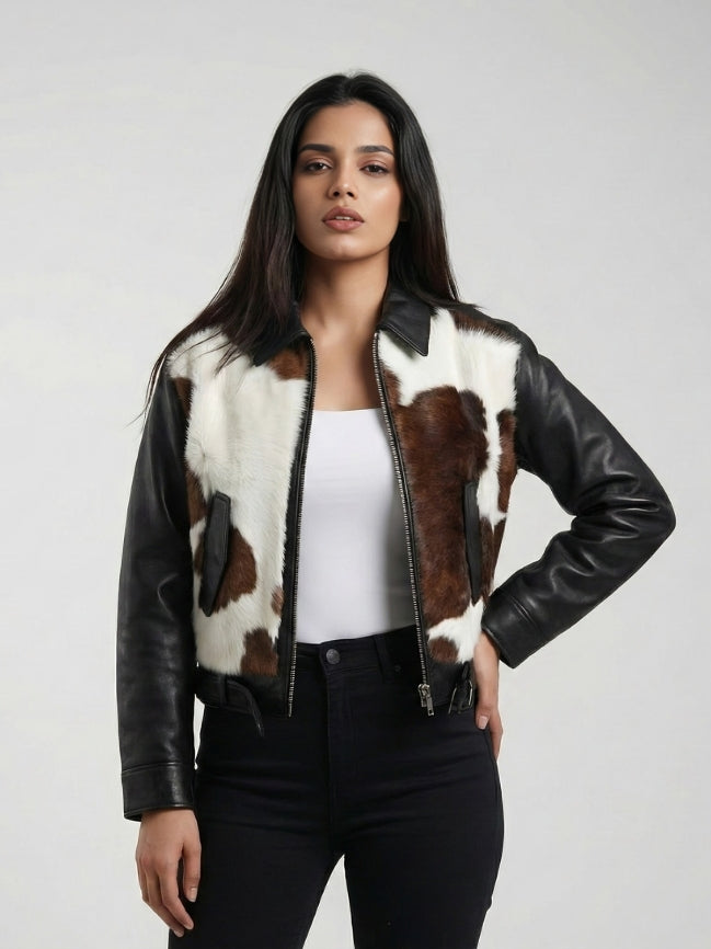 Woman wearing a black leather jacket with cowhide pattern on a white background