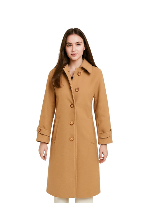 Woman wearing a tan coat on a white background
