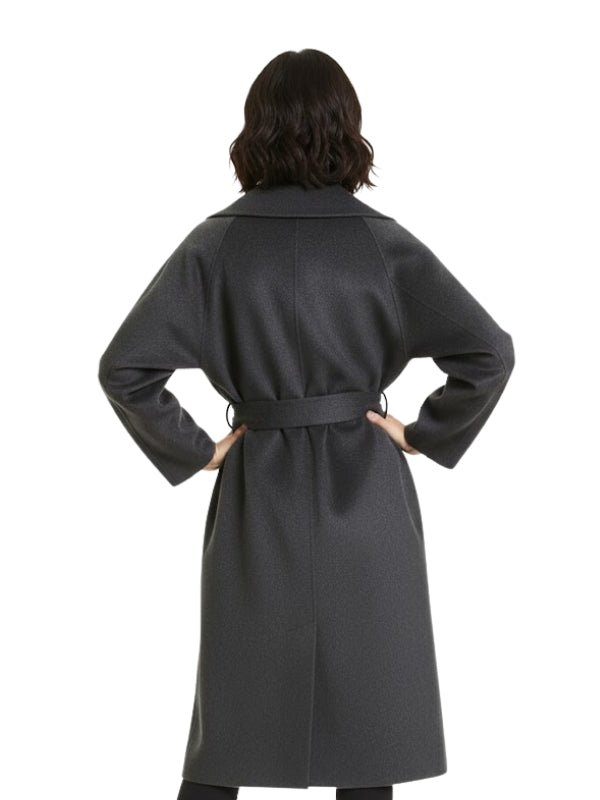 Person wearing a gray coat with a belt on a white background