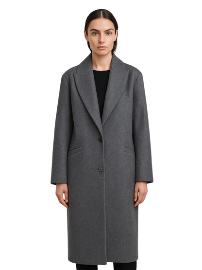 Woman wearing a gray coat on a white background