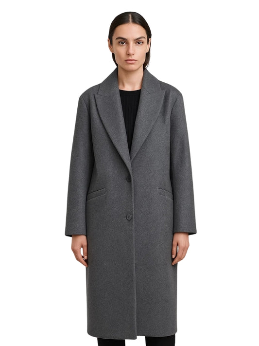 Woman wearing a gray coat on a white background