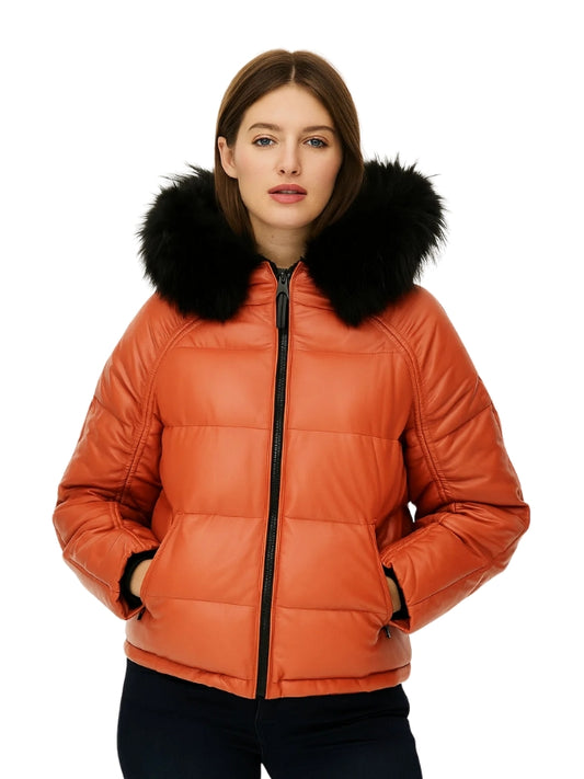 Orange puffer jacket with black fur hood worn by a model on a white background