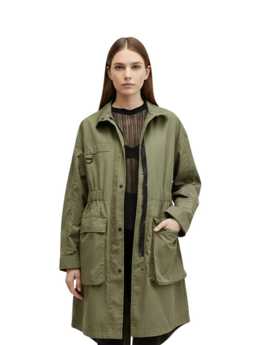 Woman wearing a green jacket on a white background