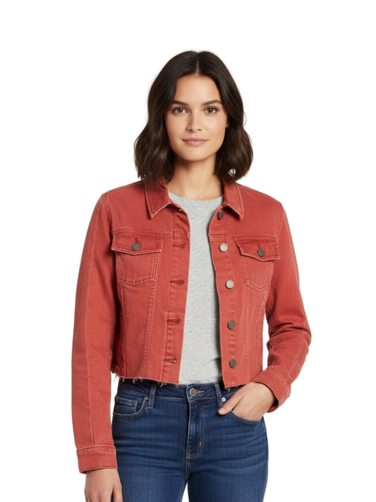 Woman wearing a red denim jacket on a white background