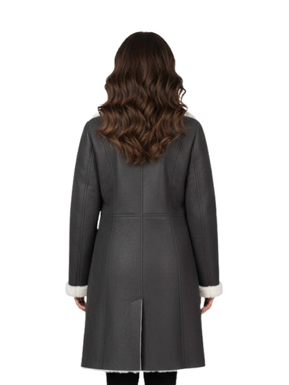 Woman wearing a gray coat with white trim on a white background