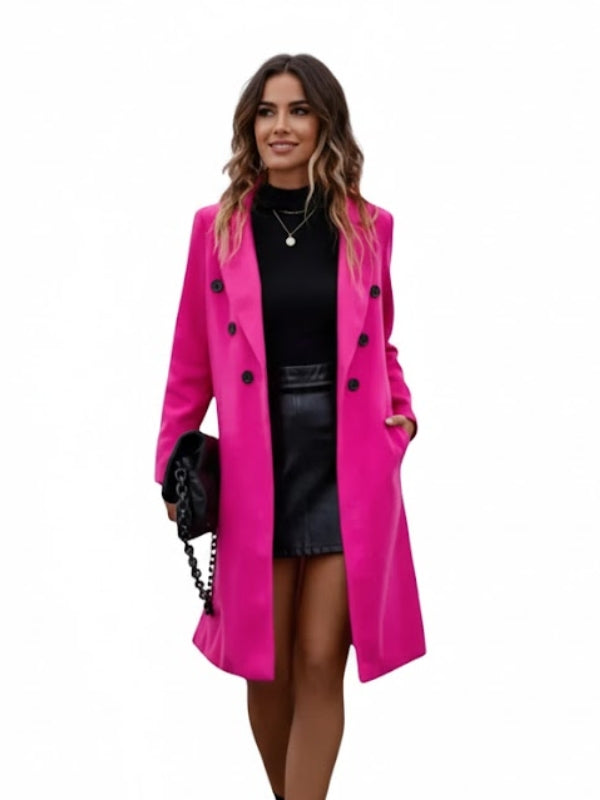 Woman wearing a bright pink coat on a white background