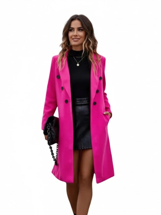 Woman wearing a bright pink coat on a white background