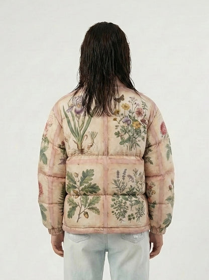 Person wearing a floral-patterned puffer jacket on a white background
