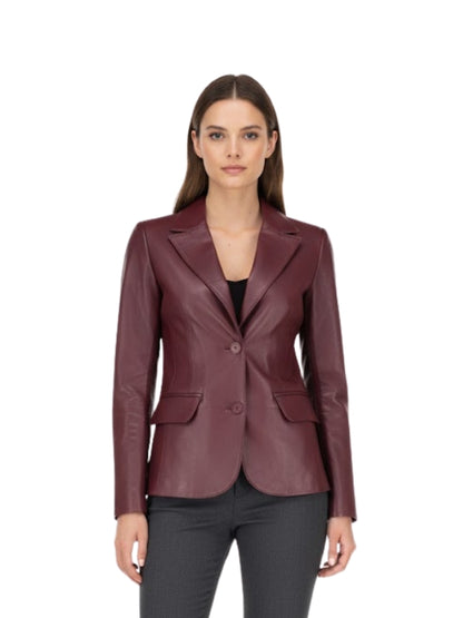 Woman wearing a burgundy leather blazer on a white background