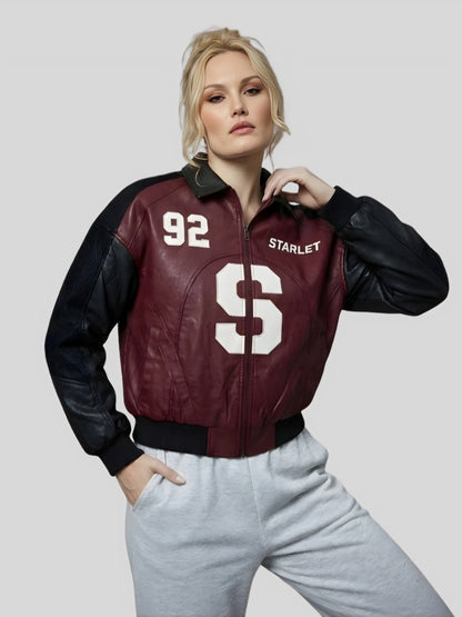 Woman wearing a maroon and black varsity jacket with 'Starlet' branding on a gray background