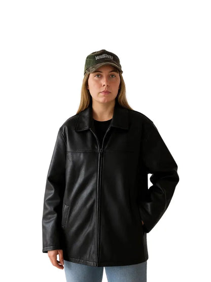 Women’s oversized black leather jacket with straight fit and classic minimalist design.