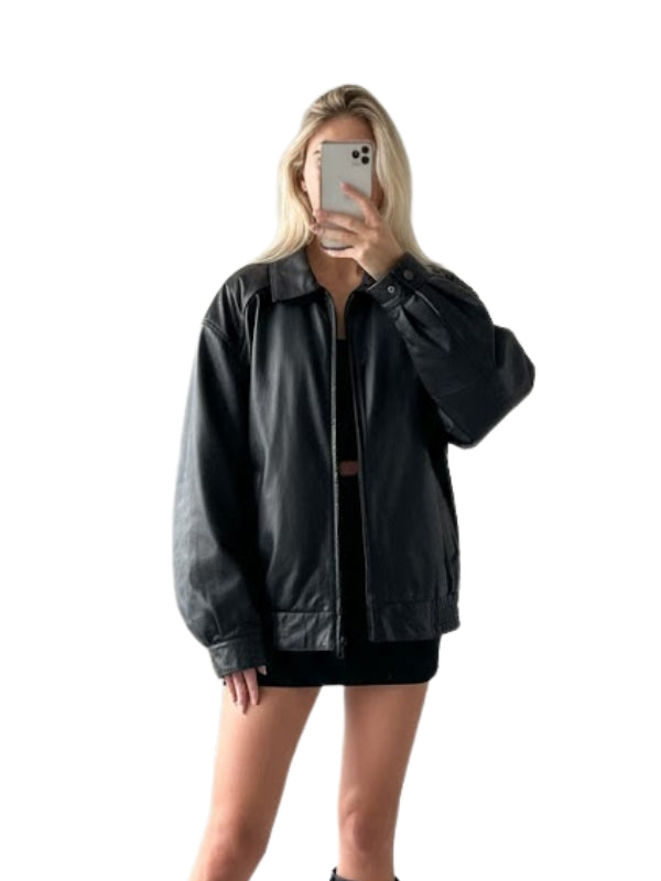 Person wearing a black leather jacket on a white background