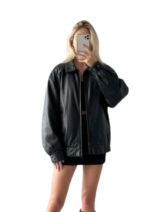 Person wearing a black leather jacket on a white background