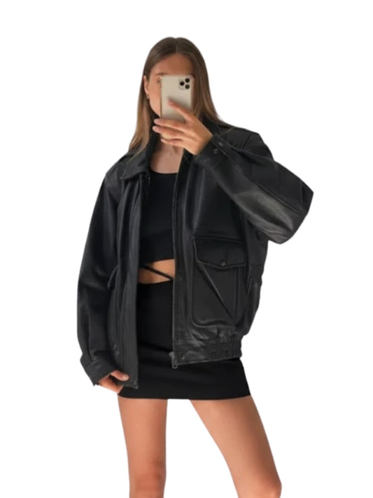 Person wearing a black leather jacket and black outfit on a white background