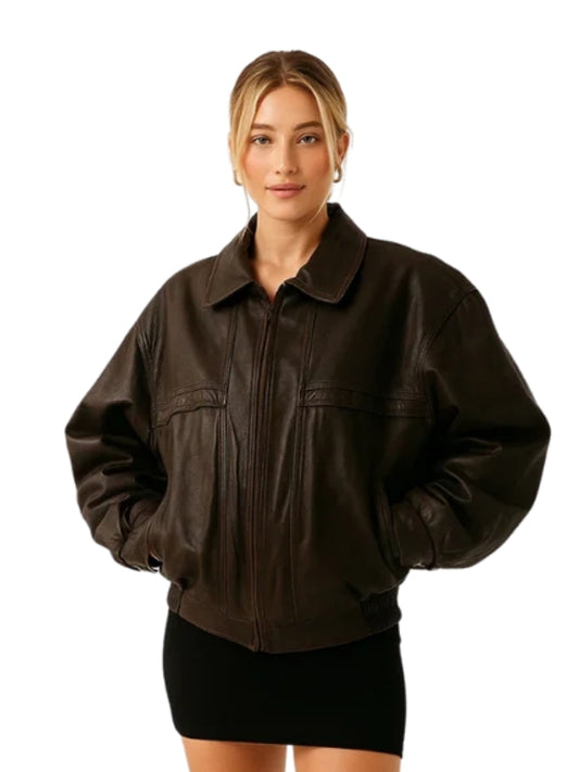 Woman wearing a brown leather jacket on a white background