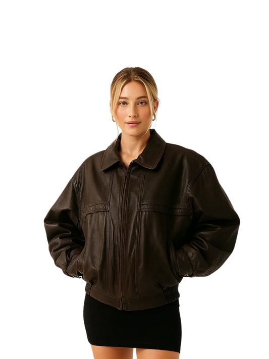Woman wearing a brown leather jacket on a white background