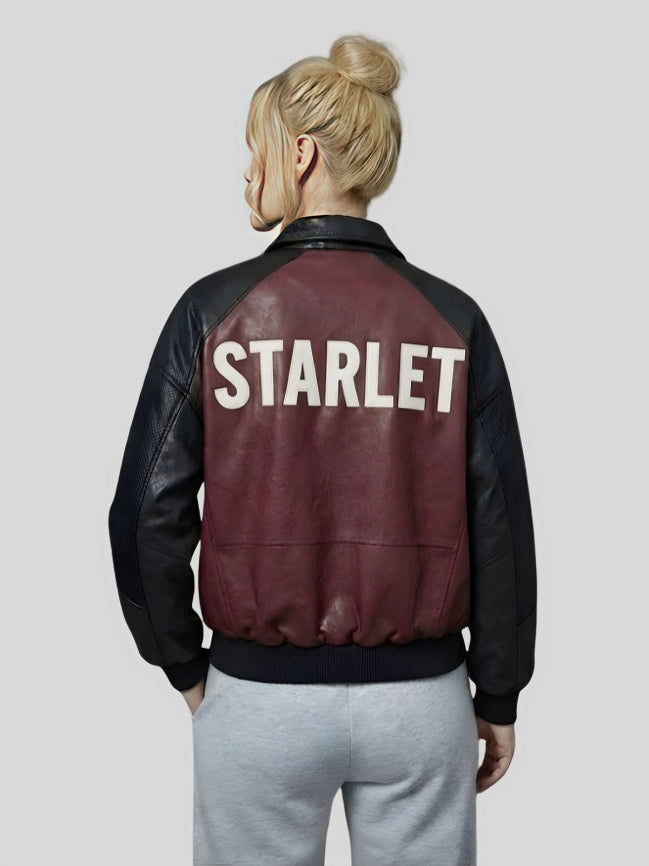 Person wearing a maroon and black jacket with 'STARLET' on the back against a plain background