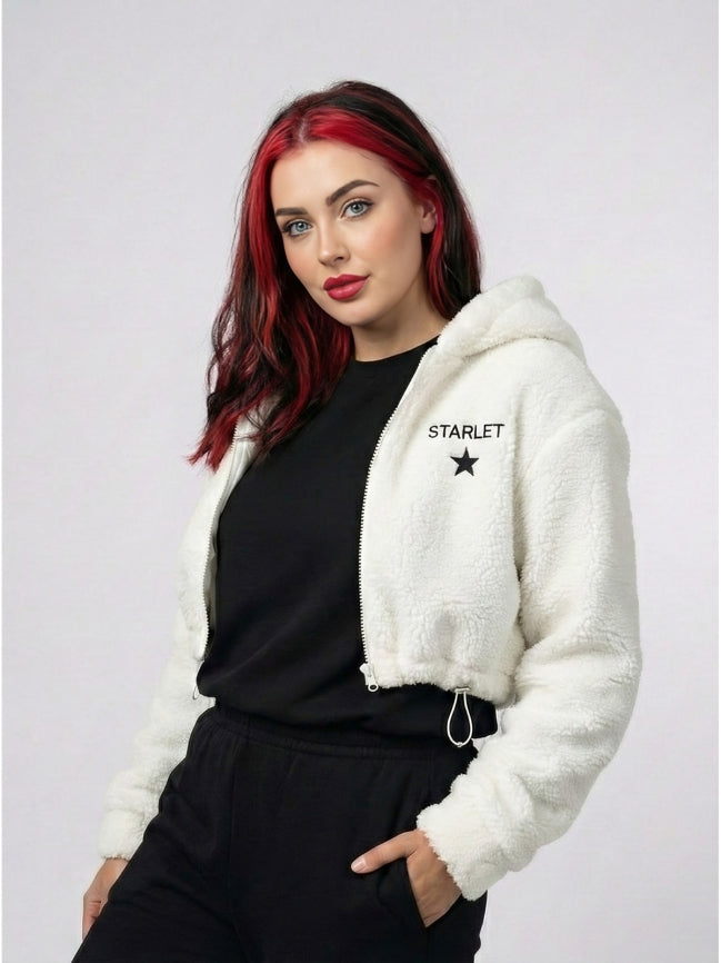 Woman wearing a white hoodie with 'STARLET' branding on a plain background
