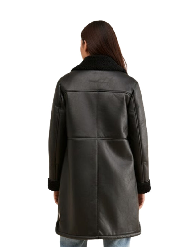 Person wearing a black leather coat on a white background