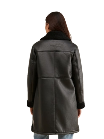 Person wearing a black leather coat on a white background