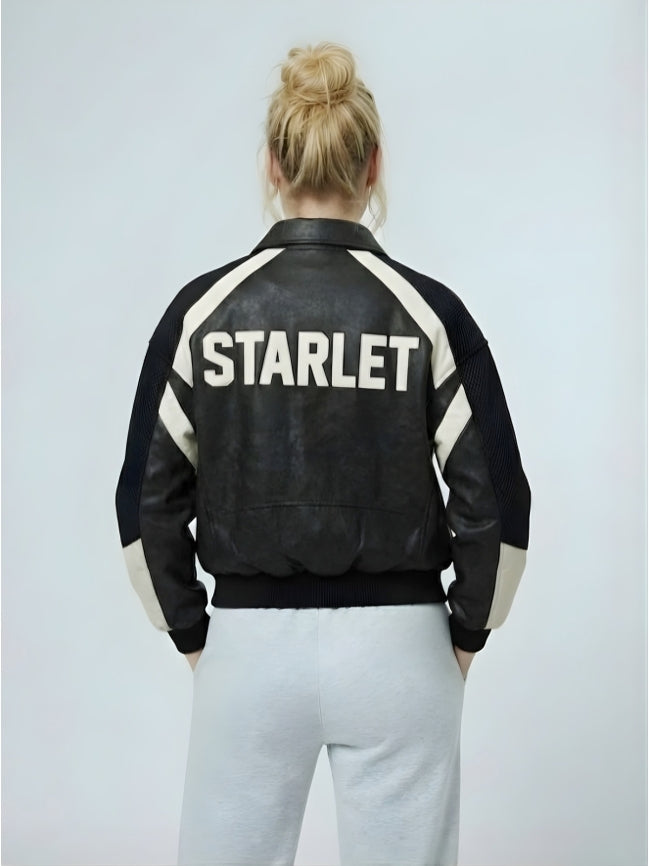 Person wearing a black leather jacket with 'STARLET' on the back against a light gray background