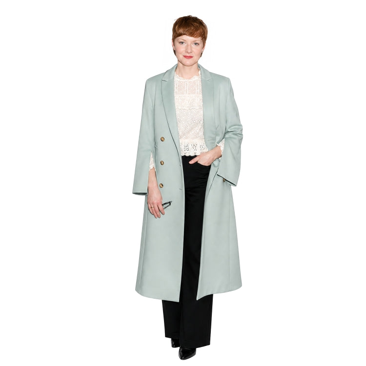 Person wearing a light blue coat on a white background
