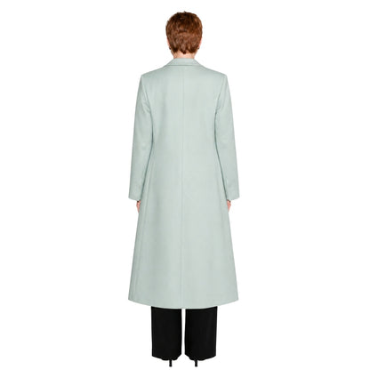 Light blue coat worn by a person on a white background