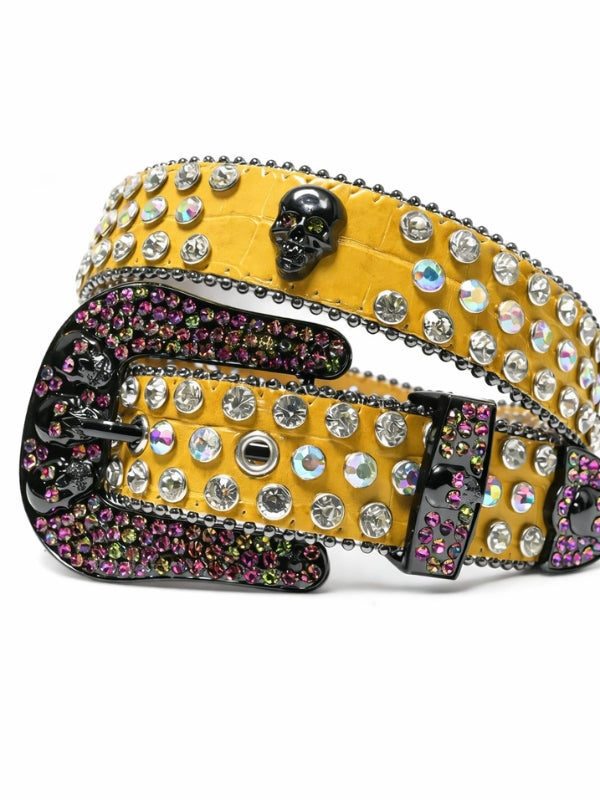 Decorative belt with rhinestones and skull design on a white background