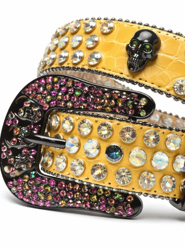 Yellow belt with rhinestone embellishments and a skull buckle on a white background